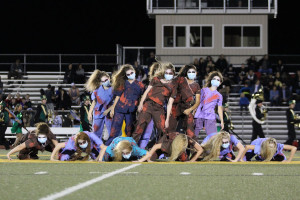 Members of the Pom Squad give a spooky dance at BC's last home game of regular season. 