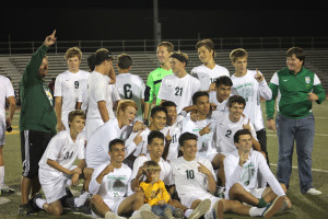 The team celebrates after being city league champions. Photo by Kenzie Borland. 