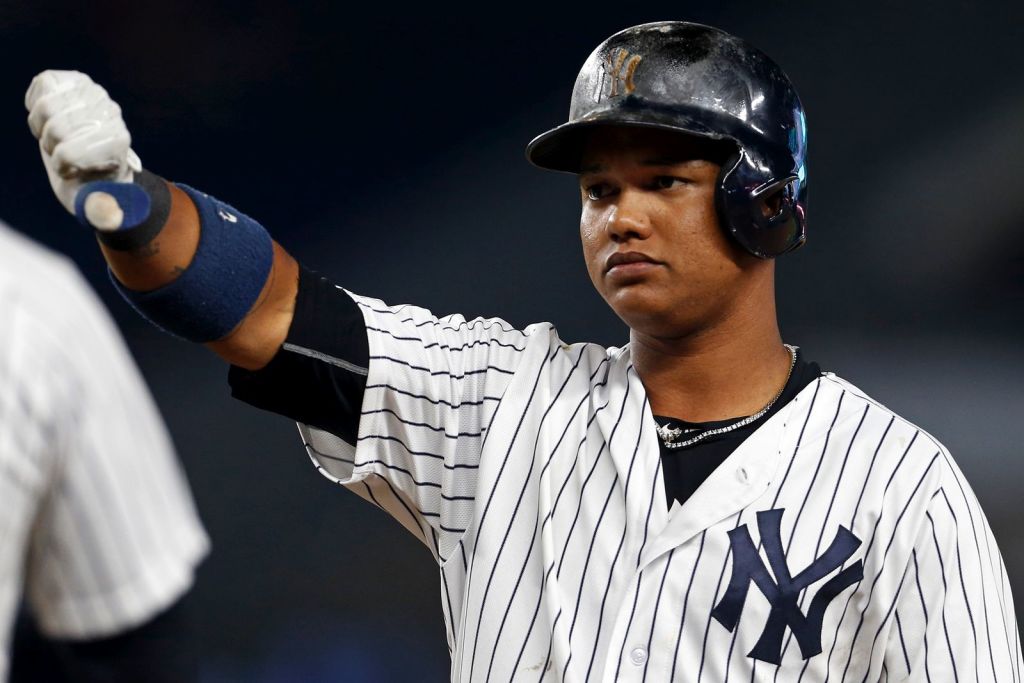 Yankees second baseball player Starlin Castro celebrating a big hit.