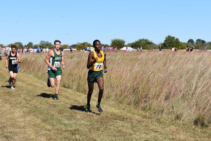 Junior Eric Nganga races in the cross country meet at El Dorado on Saturday.