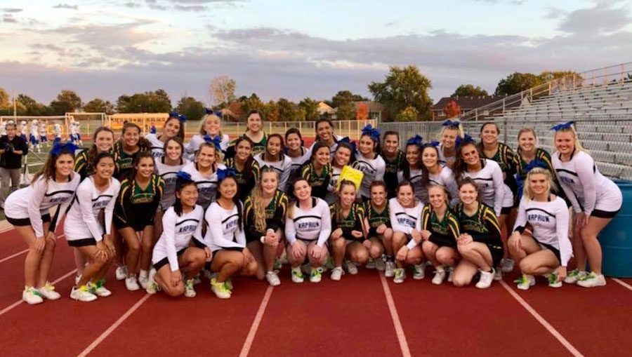 The BC cheerleaders pose with the KMC cheer team after delivering welcoming gift. 