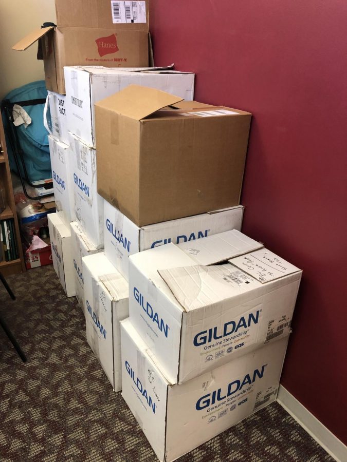 All these boxes crowding up Alan Schuckmans office are just 3 communities worth of t-shirts.
