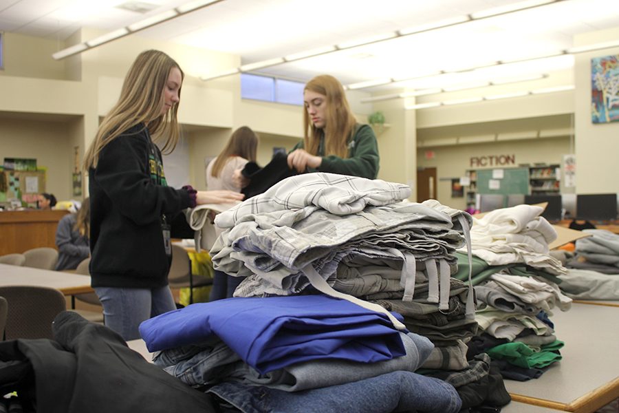 Students folded and sorted clothes Thursday morning. Photo by Joseph Winter. 