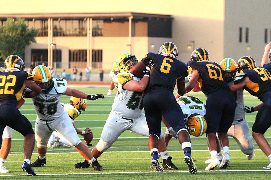 Linemen battle in the NW game. Photo by Reagan Smith. 