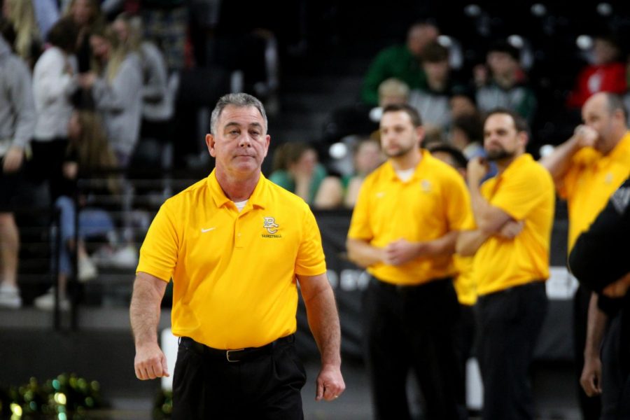 Coach Domnick pacing up and down the court during the teams matchup against Andover Central earlier in the season