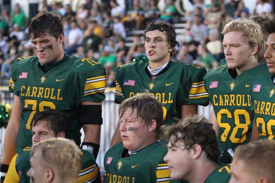 Players watch the action during the Dodge City victory. Photo by Aubrey Schnieders. 