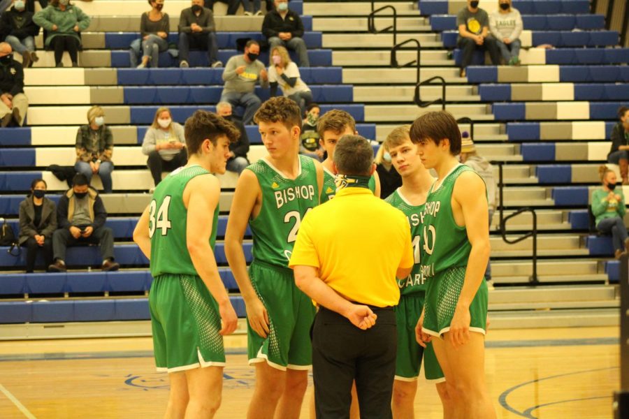 Coach Domnick speaking to his starters prior to this seasons first matchup against Kapaun